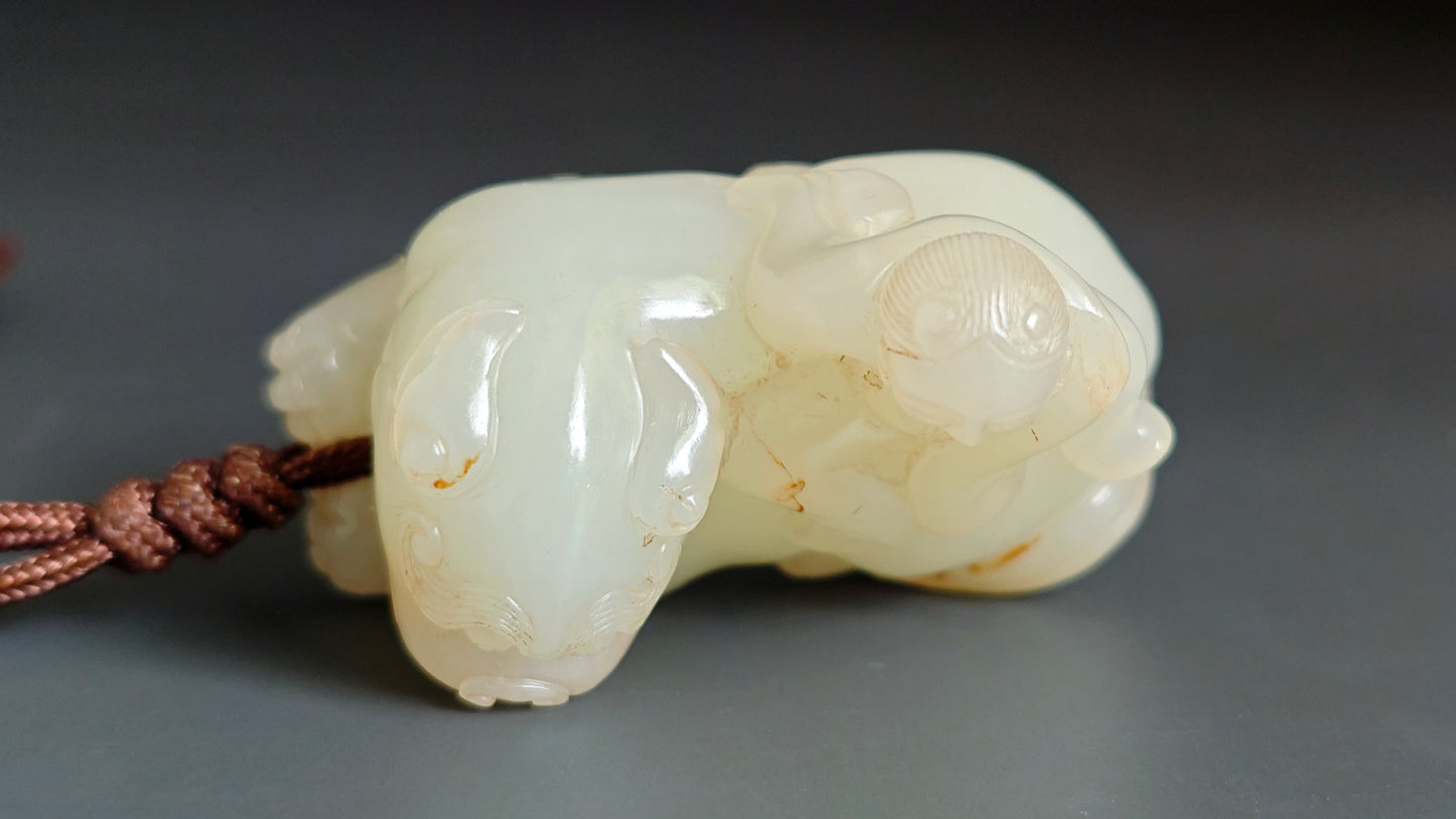 和闐玉童子騎獅雕件